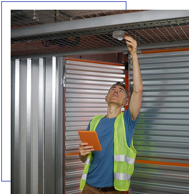 Man with tablet checking fire safety