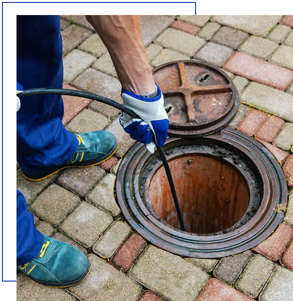 sewer cleaning service - worker clean a clogged drainage with hydro jetting