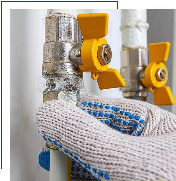 Gas leak at home. Inflating bubbles of soap mixture applied to the threaded joint on the gas pipe indicate a gas leak.